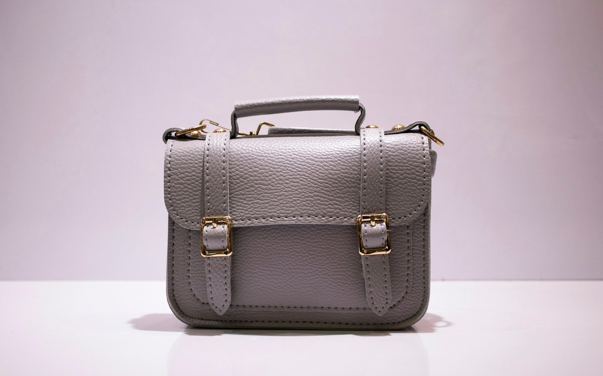 A structured leather satchel with metal fittings