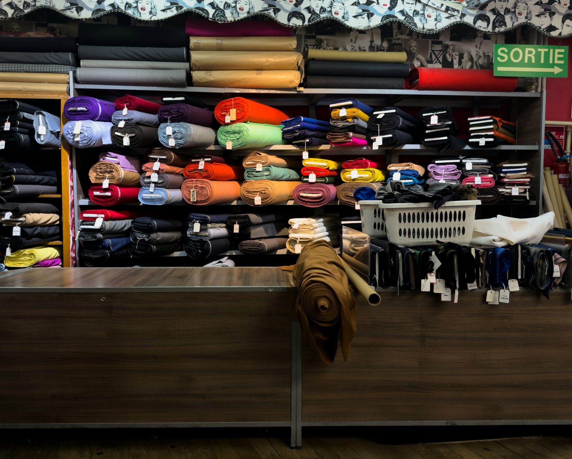 A fabric trading unit with stock stacked to the ceiling