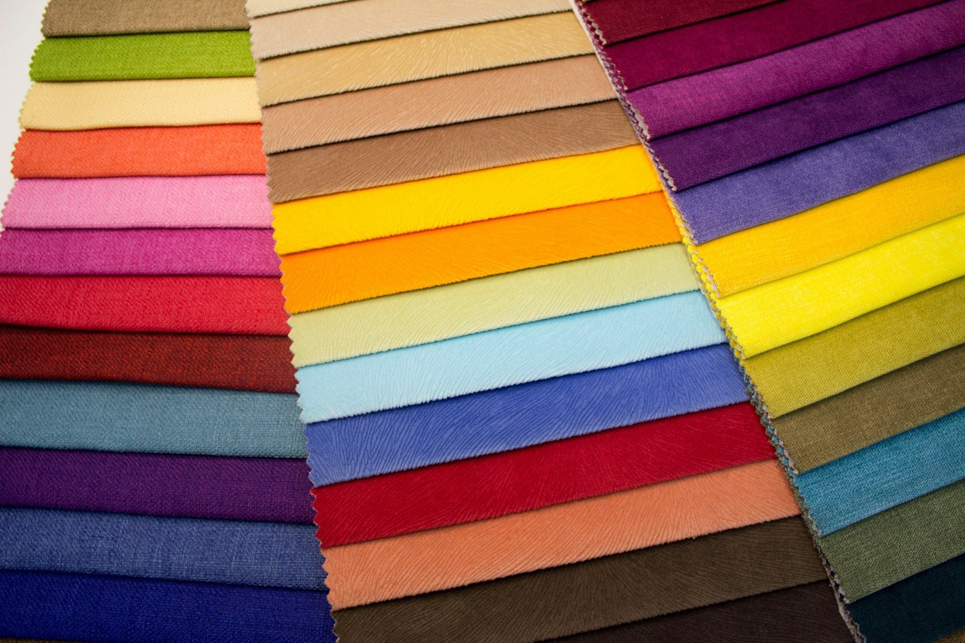 Fabric swatches laid out in a full colour range