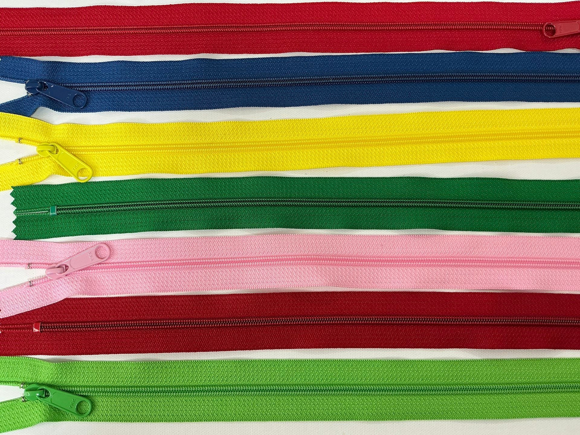 Zips in a full range of colours laid out in rows