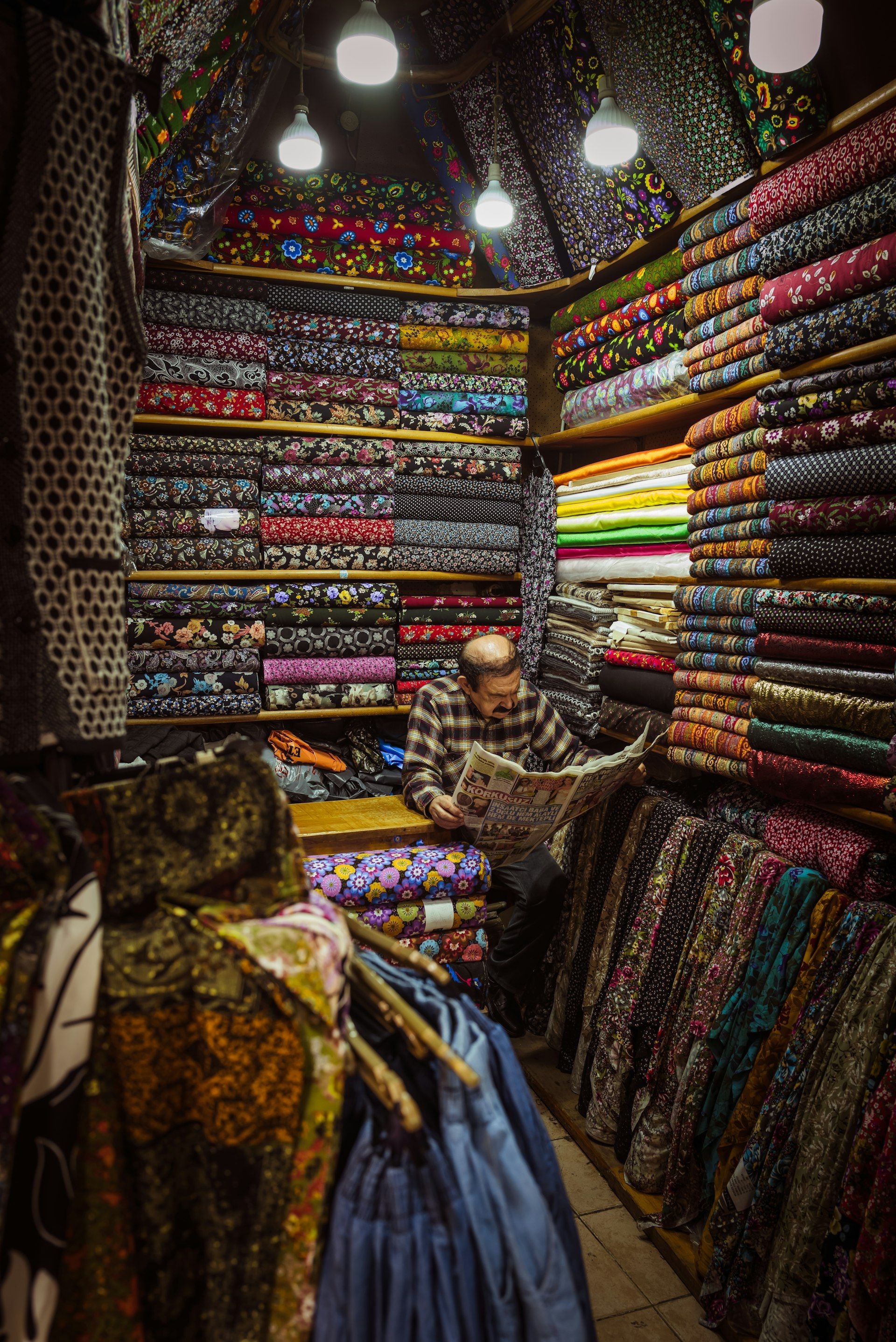 Fabric stacked along the aisle of a trading hall