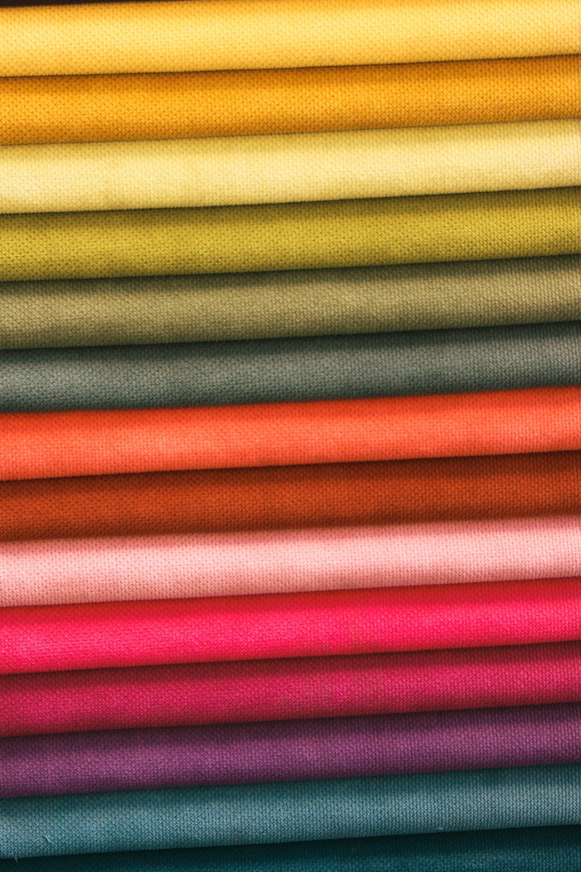 Fabric folded and sorted by colour family