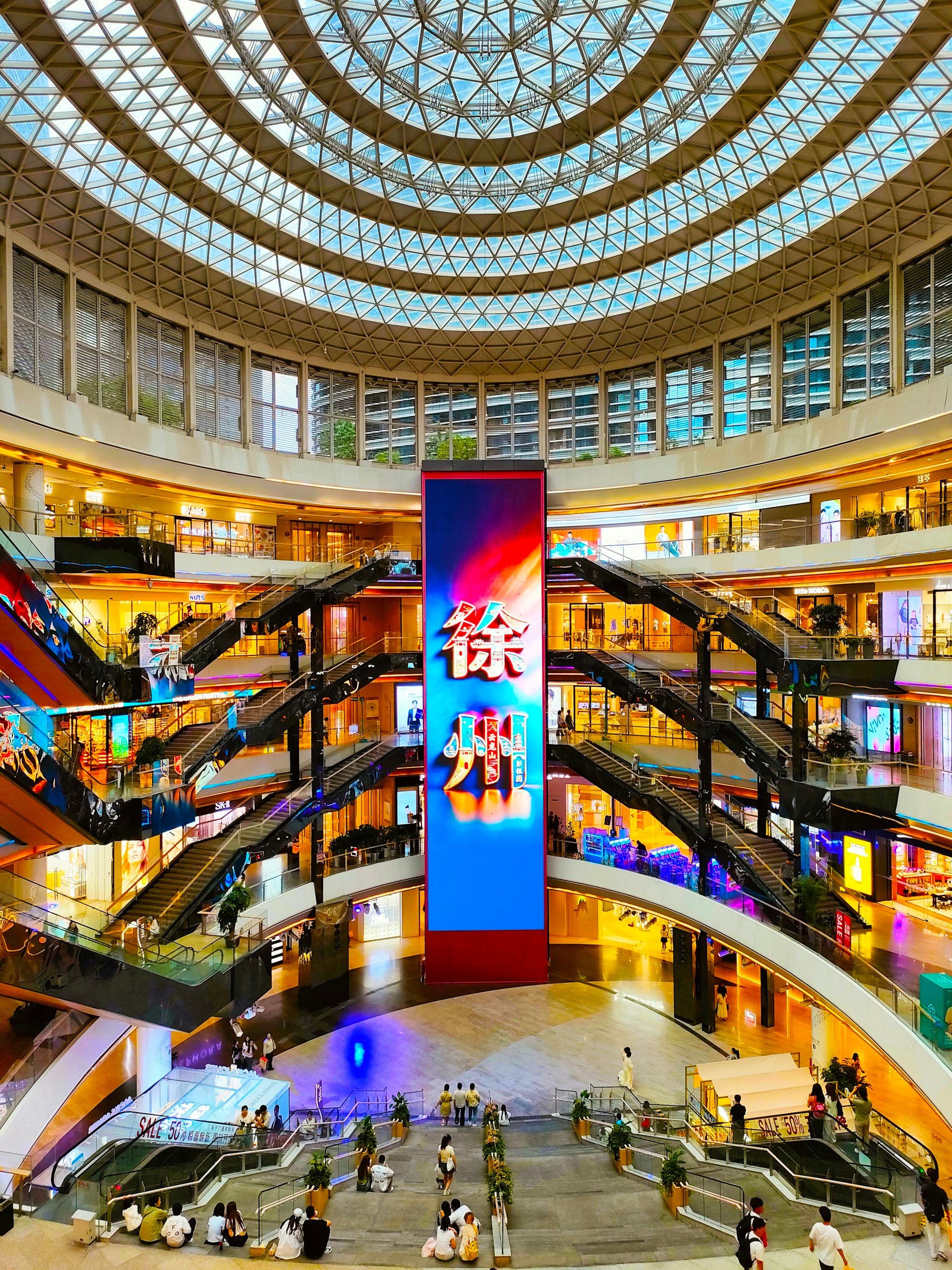 Escalators rising through a multi-level trade centre