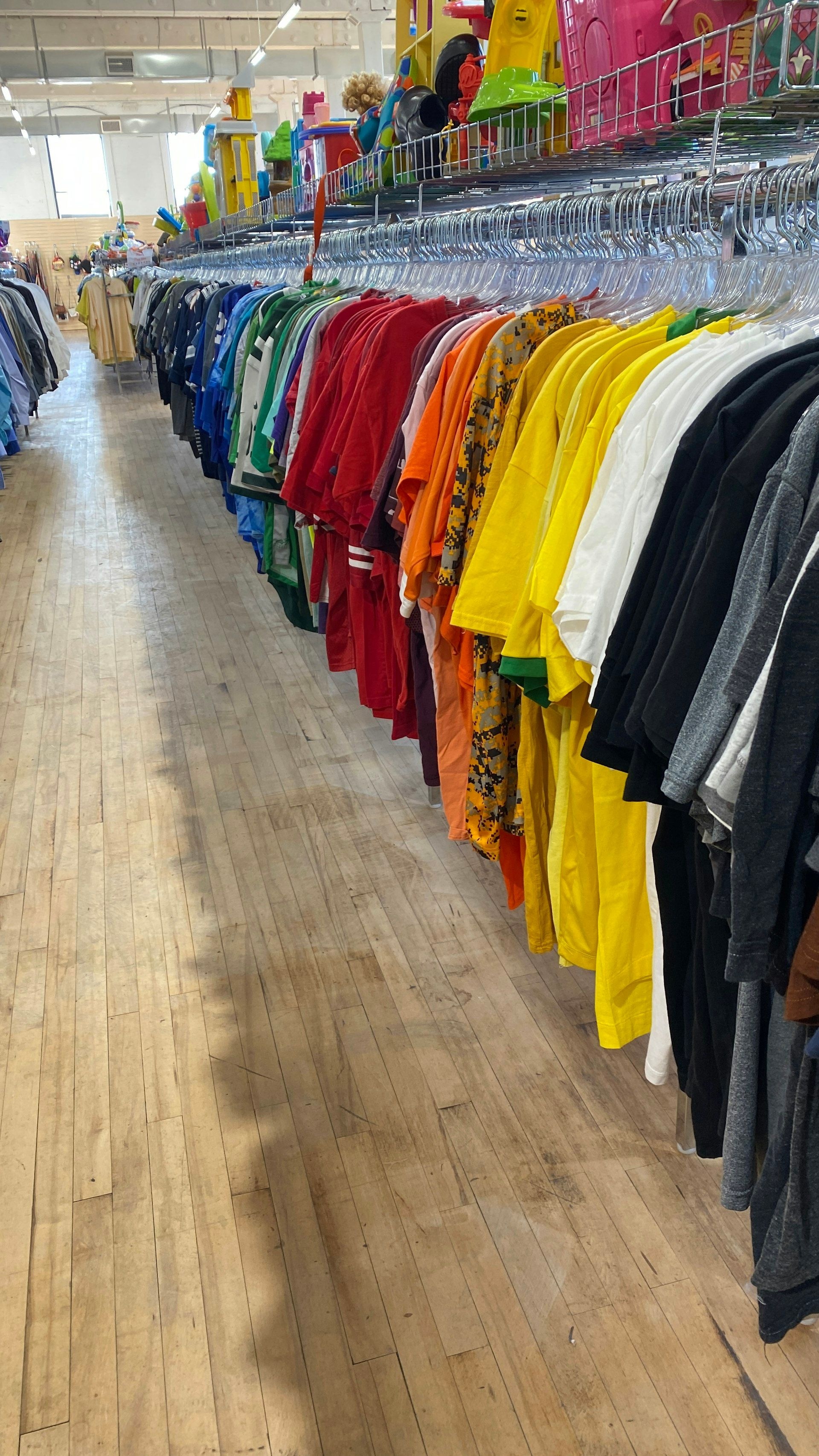 A row of shirts hanging on a rail