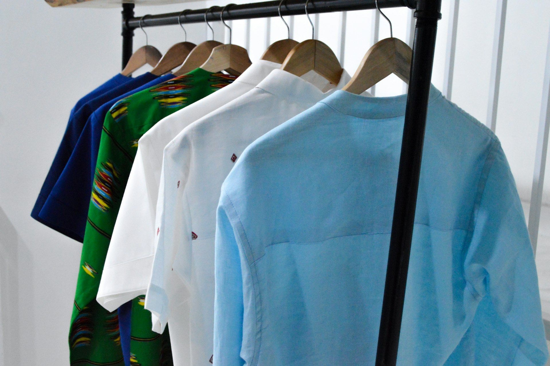 Folded polo shirts stacked by colour
