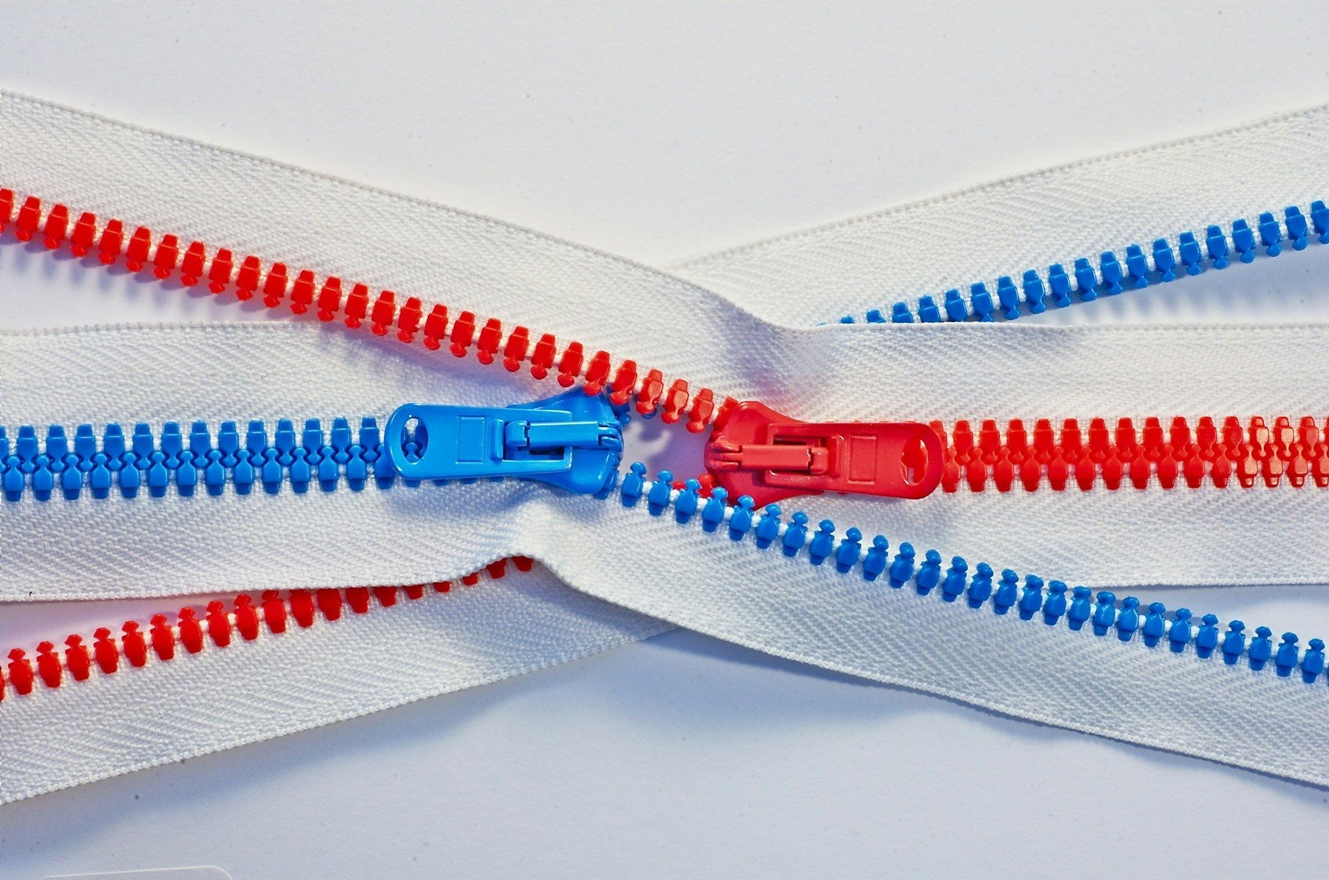 Zips in contrasting colours laid side by side