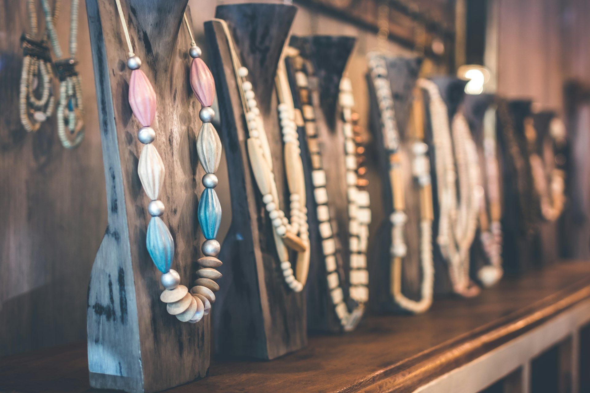 Necklaces displayed on stands in a jewellery unit