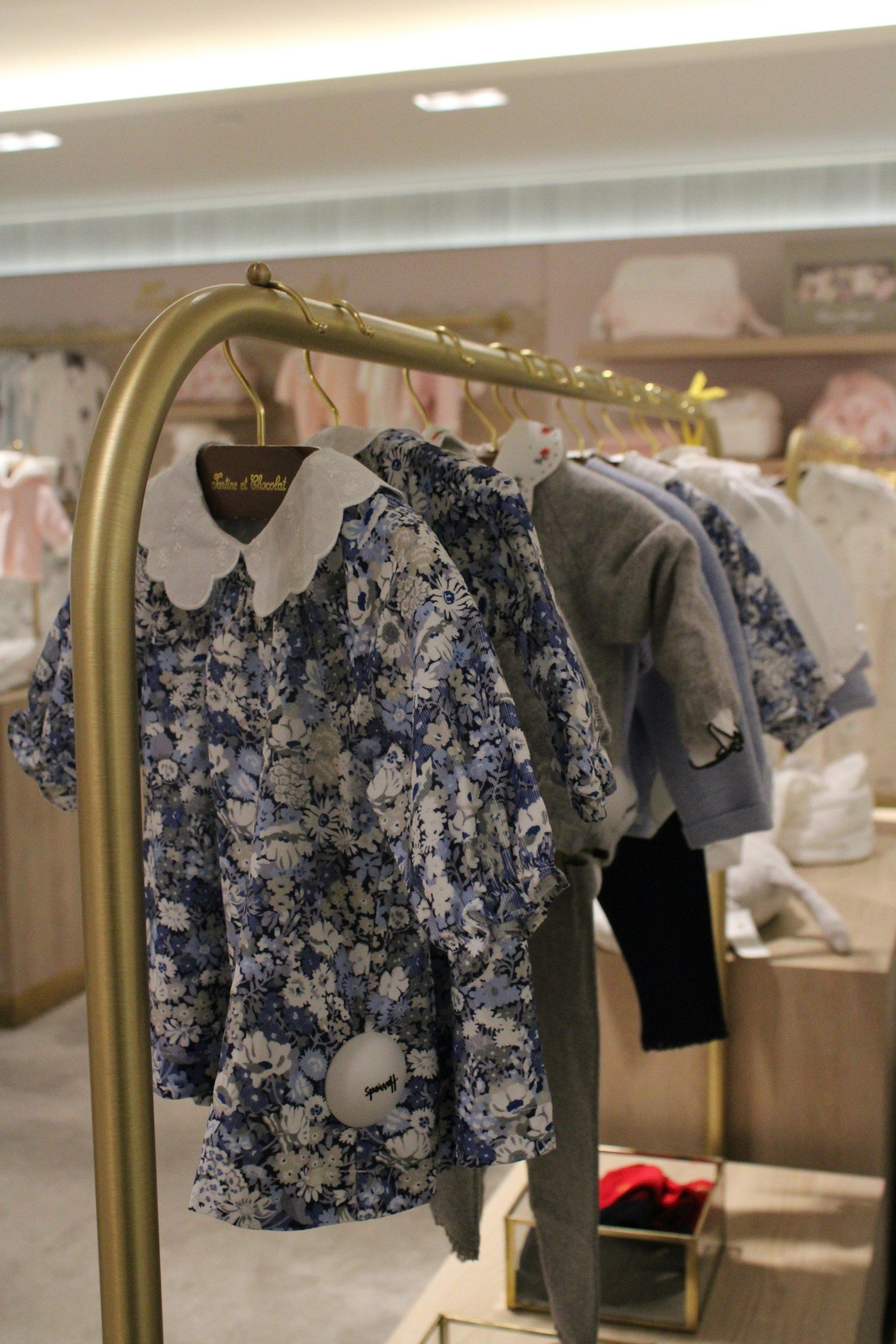 Racks of garments filling a wholesale unit