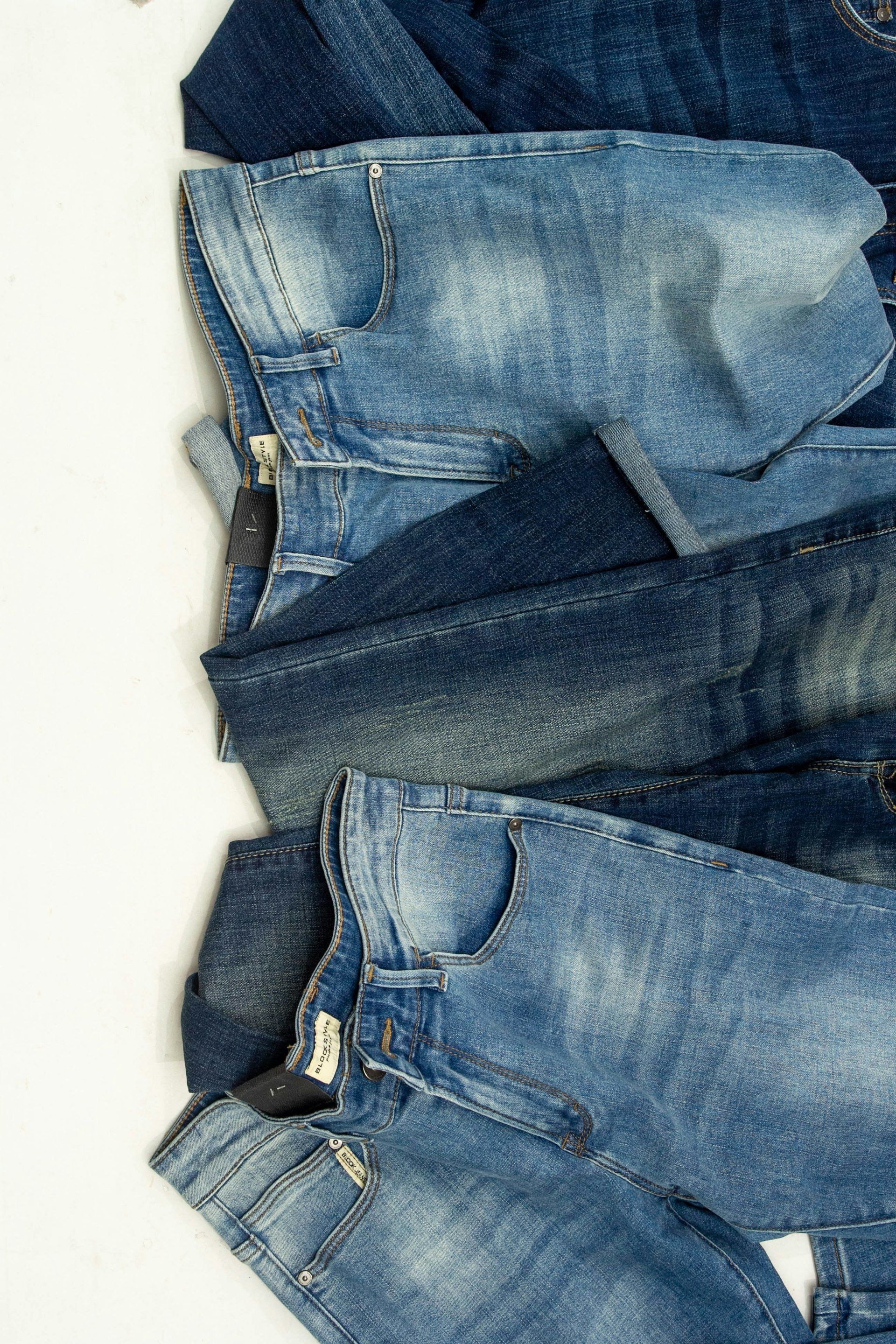 Jeans stacked in a range of washes