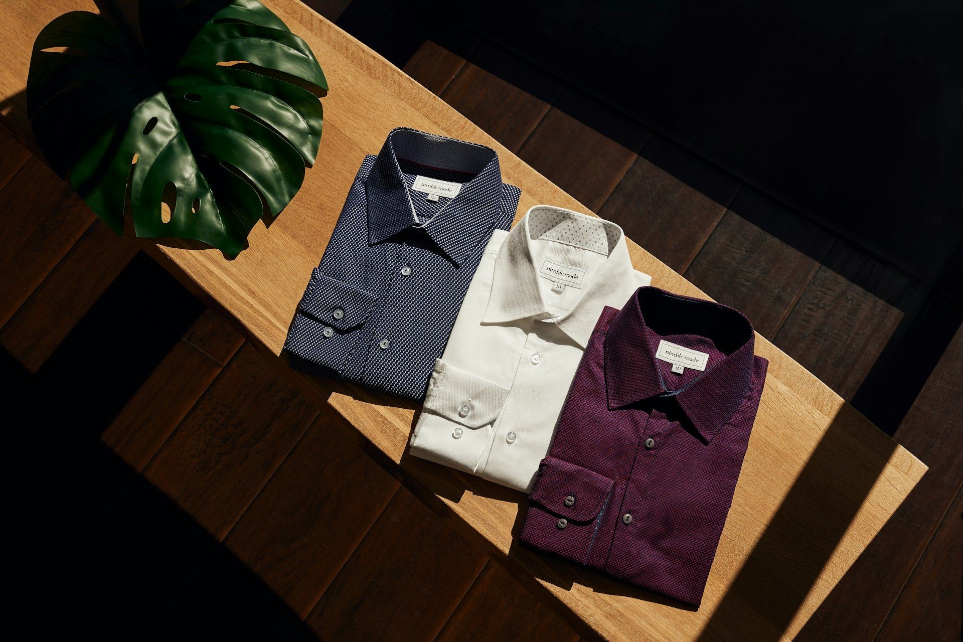 A formal shirt laid out on a work surface