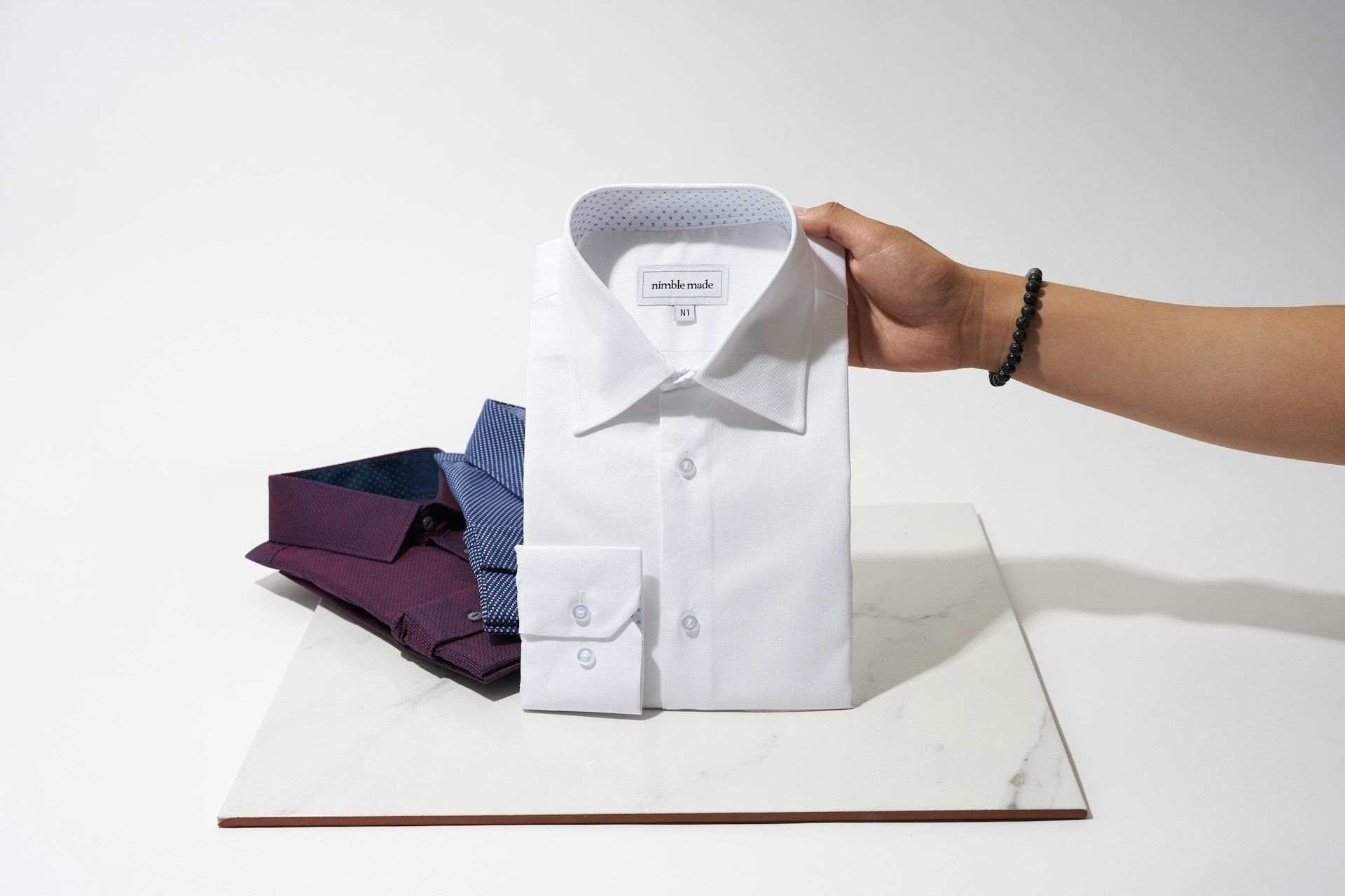 A dress shirt being presented for inspection