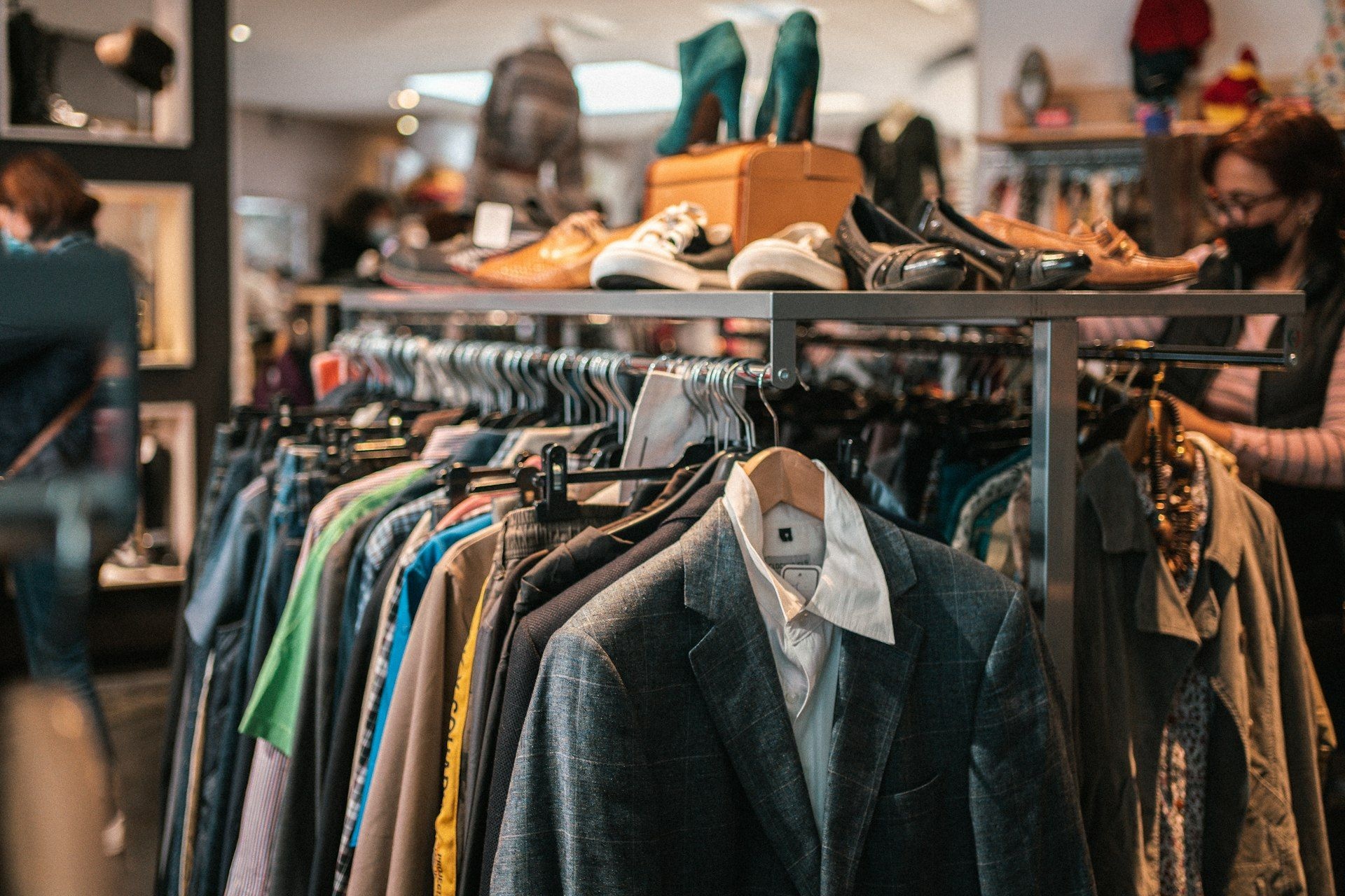 Garments and footwear displayed together in a trade unit