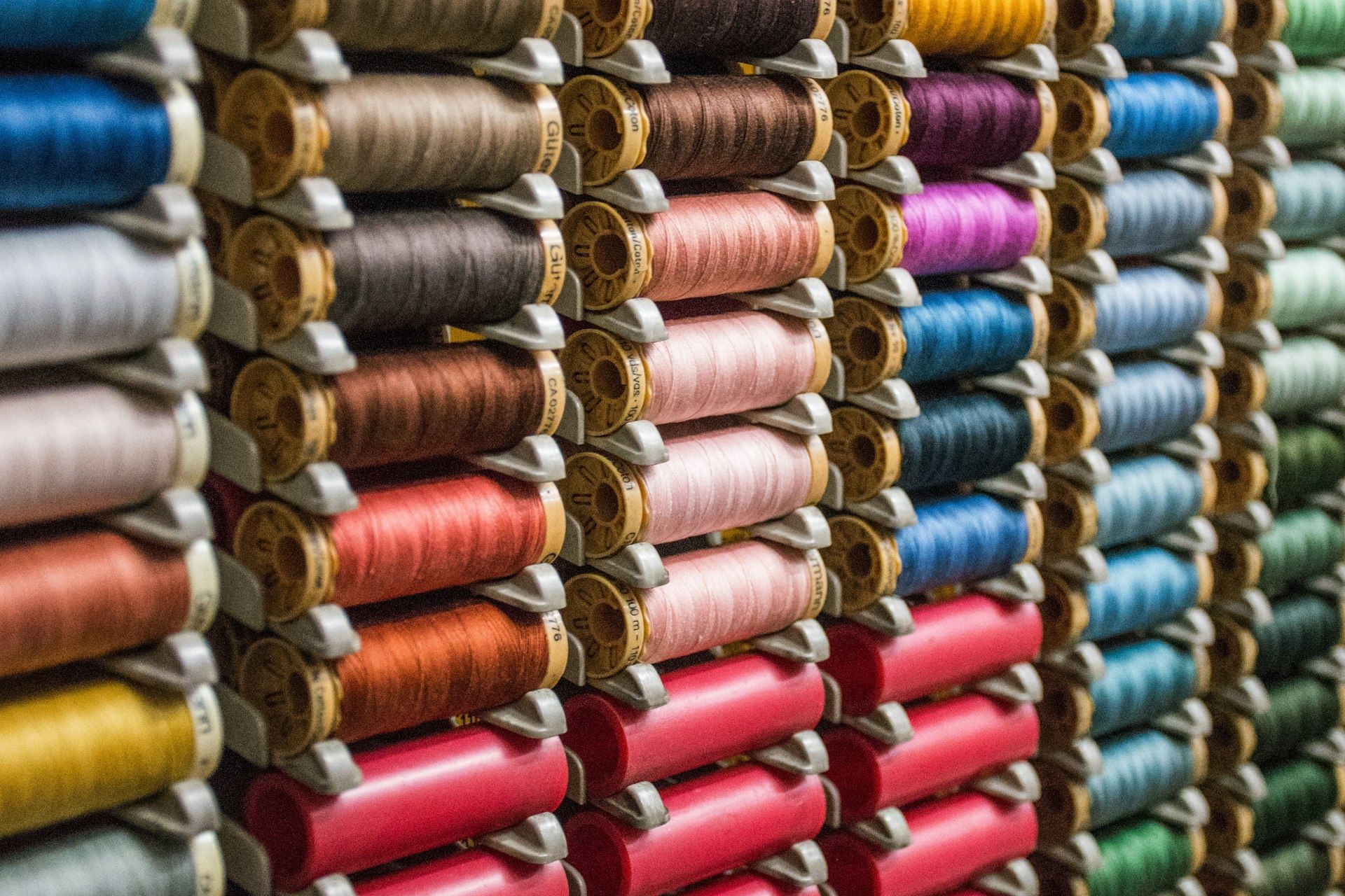 Cones of thread matched to fabric colourways
