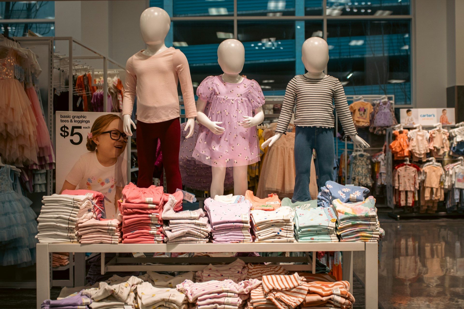 Child mannequins dressed in a kidswear display