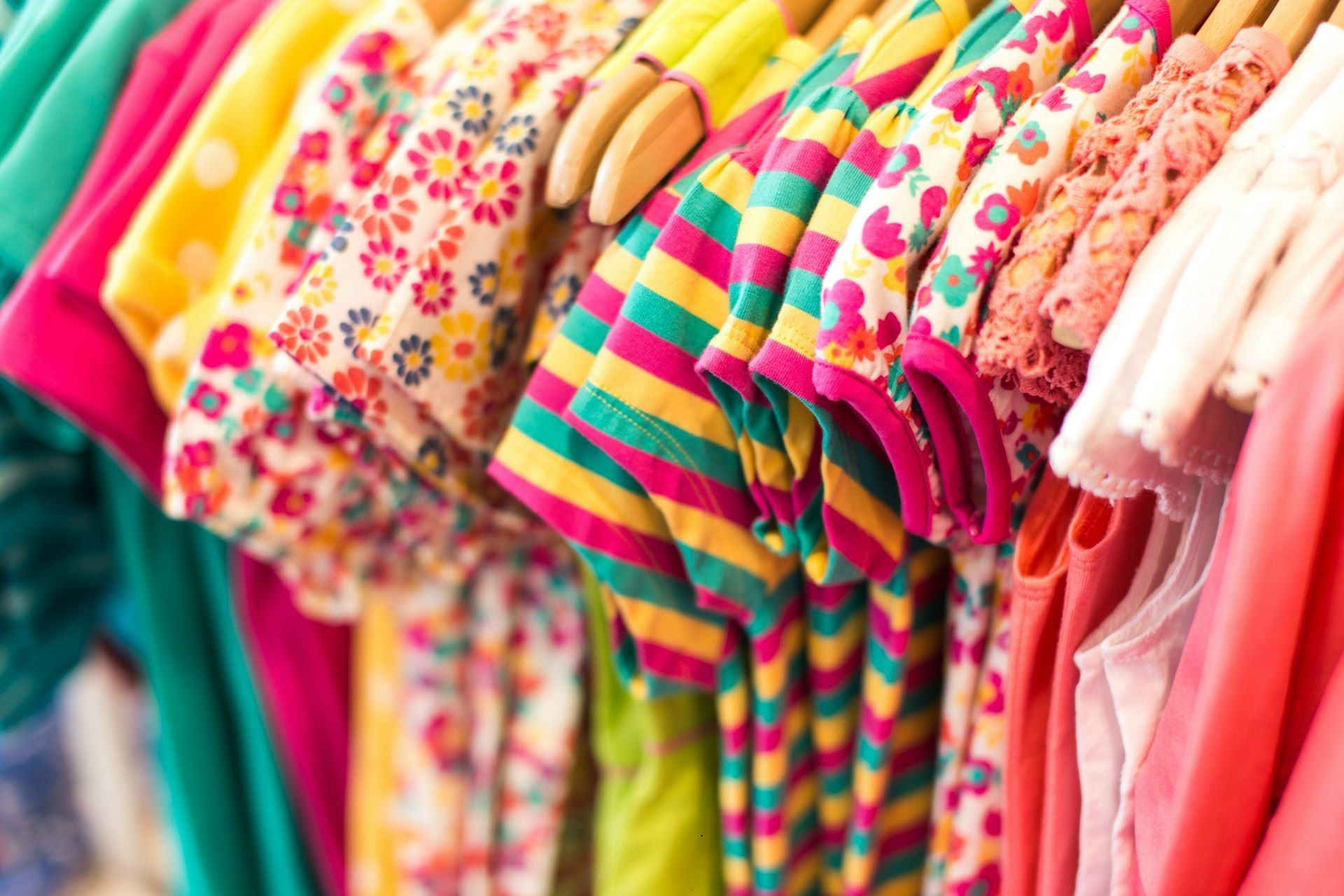 Assorted children's garments folded by colour