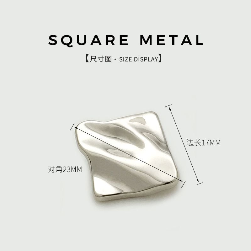Irregular wrinkled square metal button with textured surface