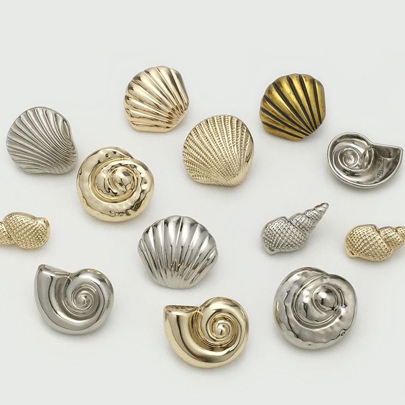 Stylish irregular shell-shaped metal button with ocean vibe