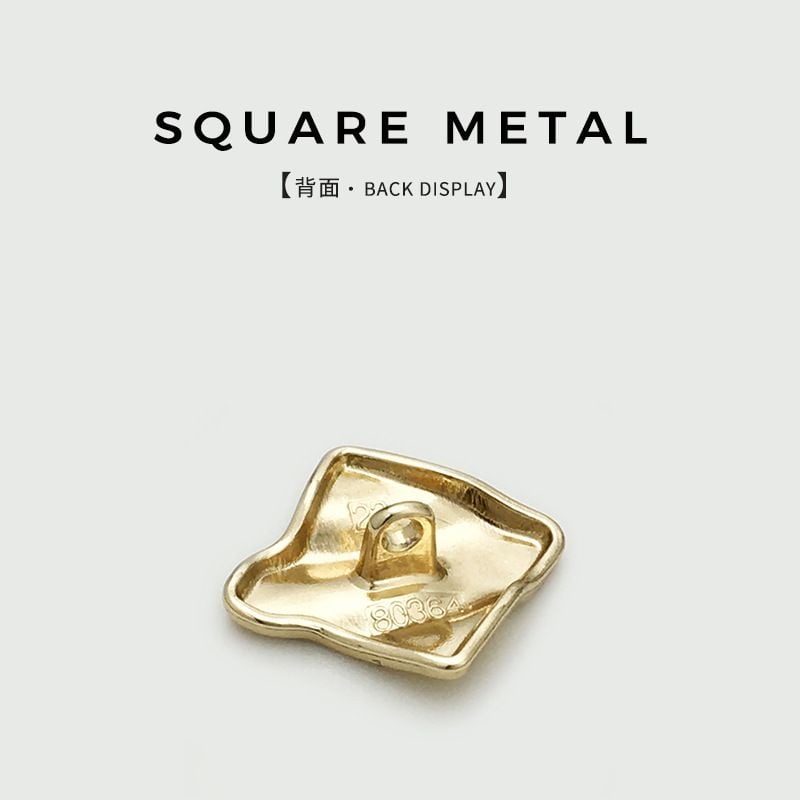 Irregular wrinkled square metal button with textured surface